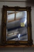 Gilt framed wall mirror