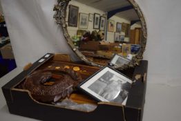 An oval faux wood framed wall mirror together with quantity of assorted pictures and frames