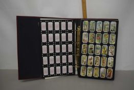 The Card Collectors Society, an album of cigarette cards