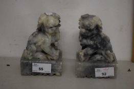 A pair of stone ware dogs of fo