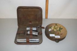 A tambourine and a gentlemans dressing set
