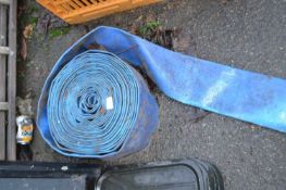 A large blue plastic hose