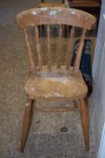 A spindle back kitchen chair