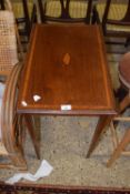 An Edwardian mahogany side table with inlaid shell decoration
