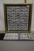 Quantity of framed cigarette cards of cars together with an album of other cigarette cards