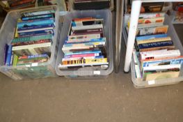 Three plastic boxes of various mixed books
