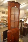 Two standard lamps and a corner cabinet