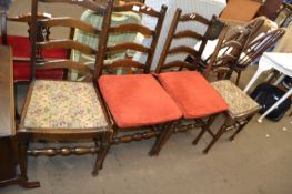 A set of four ladder back kitchen chairs