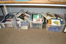 Four plastic boxes of mixed books