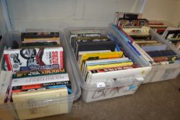 Three plastic boxes of mixed books