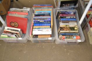 Three plastic boxes of mixed books