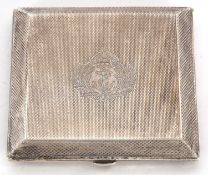 An Edwardian silver ladies compact, having overall engine turned decoration around a central navy