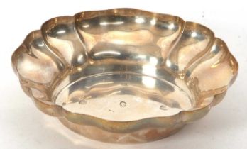 A sterling silver dish with scallop rim border, marked for Barker Ellis & Co, Birmingham 1977,