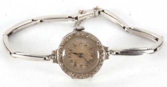 A precious metal ladies cocktail watch, the case is stamped Platine and features a single cut