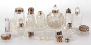 Quantity of glass scent bottles and small jars, mainly with silver tops, collars, lids etc