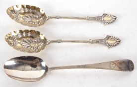 A pair of Victorian silver berry spoons, Birmingham 1873, makers mark Elkington & Co, 19.5cm long