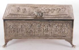 An Indian silver cigarette box, circa 1900 of rectangular form supported on four cast feet,