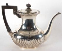 A George V silver coffee pot, applied gadrooned rim with half fluted decoration to the body,