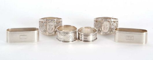 Mixed Lot: A pair of George V silver D shaped serviette rings with a pierced leaf design around an