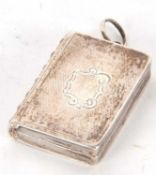 A Victorian silver vinaigarette, circa 1836 in a form of a bound book with engine turned