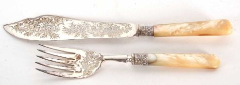 Pair of late Victorian silver bladed servers with chased and engraved floral decoration, having