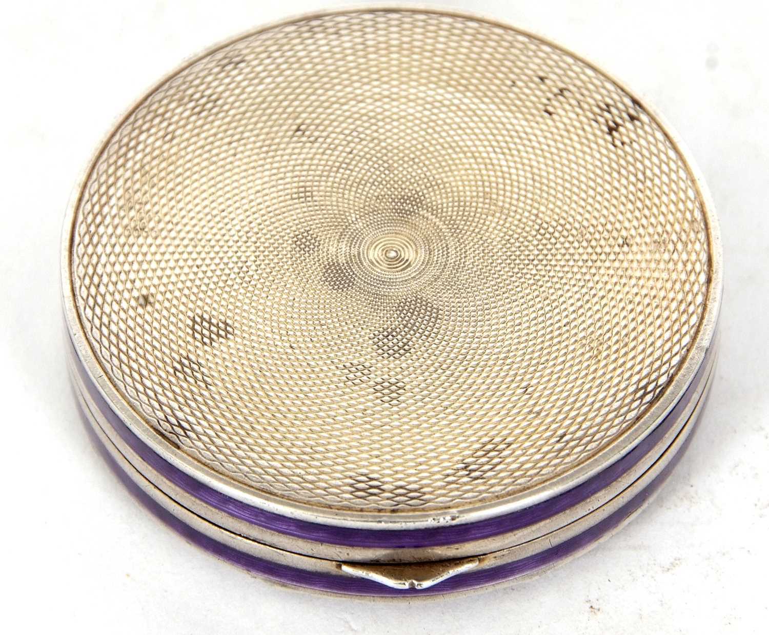 A white metal and enamel compact of octagonal form, the lid decorated with a purple guilloche enamel - Image 2 of 2