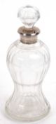 A George VI glass silver decanter, the cut glass body of waisted form having a hallmarked silver