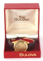 A Bulova Super Seville calendar gents wristwatch, the watch has a quartz movement, gold coloured