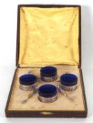 Four French silver pierced circular open salts with blue glass liners, each marked with the