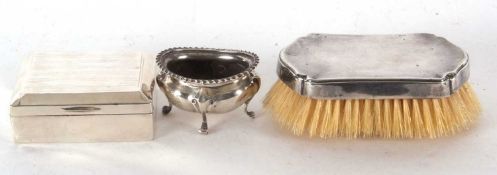 Mixed Lot: Hallmarked silver oval salt, marks rubbed, an early 20th Century silver cigarette box