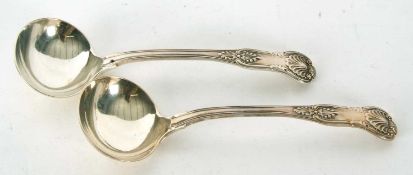 A pair of William IV Kings pattern ladles having shaped oval bowls, hallmarked for London 1837,