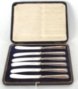A cased set of six George V silver handled butter knives, the handles marked for Sheffield 1923,