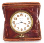 A cased Windsor Bishop of Norwich eight day clock, it has a white dial with luminous hands and