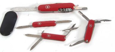 Group of four various Swiss Army penknives, two multi-tooled and two with twin blades, 5.5-9cm long