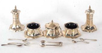 George VI five piece condiment set of shaped hexagonal form comprising two peppers, hinged lidded