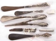 Mixed Lot: Four early 20th Century silver handled shoe horns, two silver handled pedicure tools