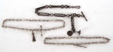 Three watch chains to include a Victorian gun metal fancy link chain suspending a one dime coin