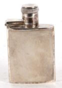 A George VI small silver spirit flask, engine turned decoration back and front, hinged flip/