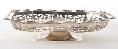 An Edwardian silver bread basket of rectangular form having a crimped edge and pierced border,