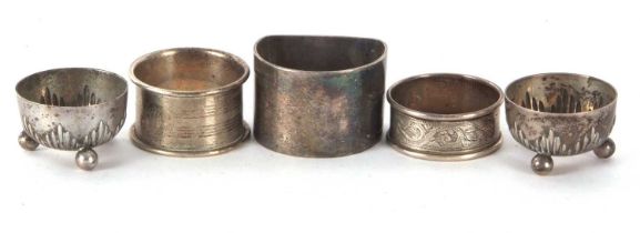 Mixed Lot: A pair of German white metal circular salts, stamped 800, hallmarked silver serviette