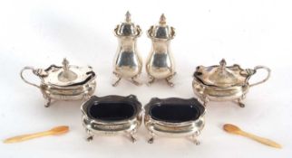 A George VI six piece condiment set comprising two peppers, two hinged lidded mustards, with blue