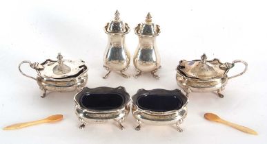 A George VI six piece condiment set comprising two peppers, two hinged lidded mustards, with blue