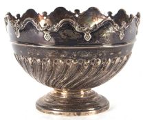 A late Victorian silver rose bowl with decorative pierced scroll and applied rim with half swirl