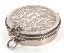 A George V silver travelling Catholic Holy Wafer Box of circular form, having an initialled hinged