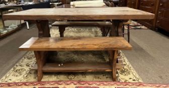 A 20th Century yew wood small refectory style dining table together with two accompanying benches,
