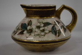 A Pinder Bourne (Doulton) faience jug with a floral design
