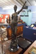 A large bronzed metal figure of Lady Justice set on a polished stone base, 100cm high