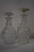 Two mid 19th Century cut glass decanters