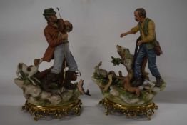 A pair of Capodimonte porcelain figures, one of a hunter and the other of a fisherman, both on