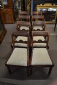 A set of eight Georgian mahogany bar and shell back dining chairs comprising two Carvers and six